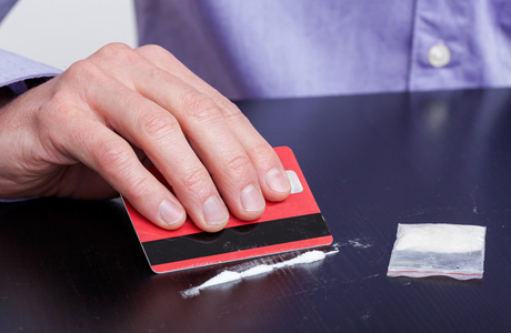 Man taking drugs before driving